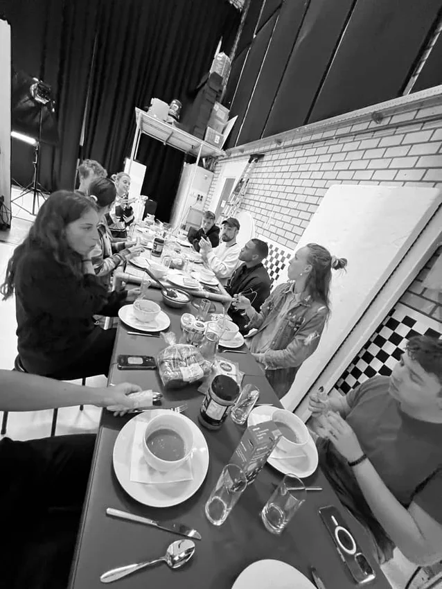 A shared meal between takes